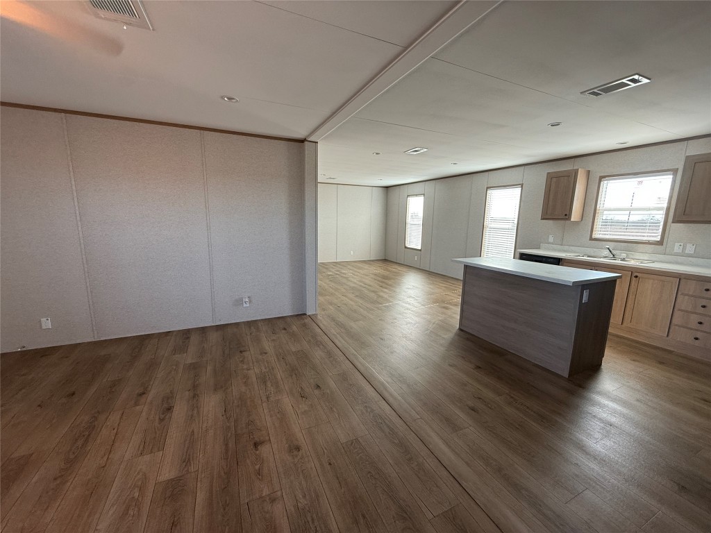 175 Altidore Avenue Dale, TX 78616 - Photo 20 of 21 an empty room with wooden floor and windows