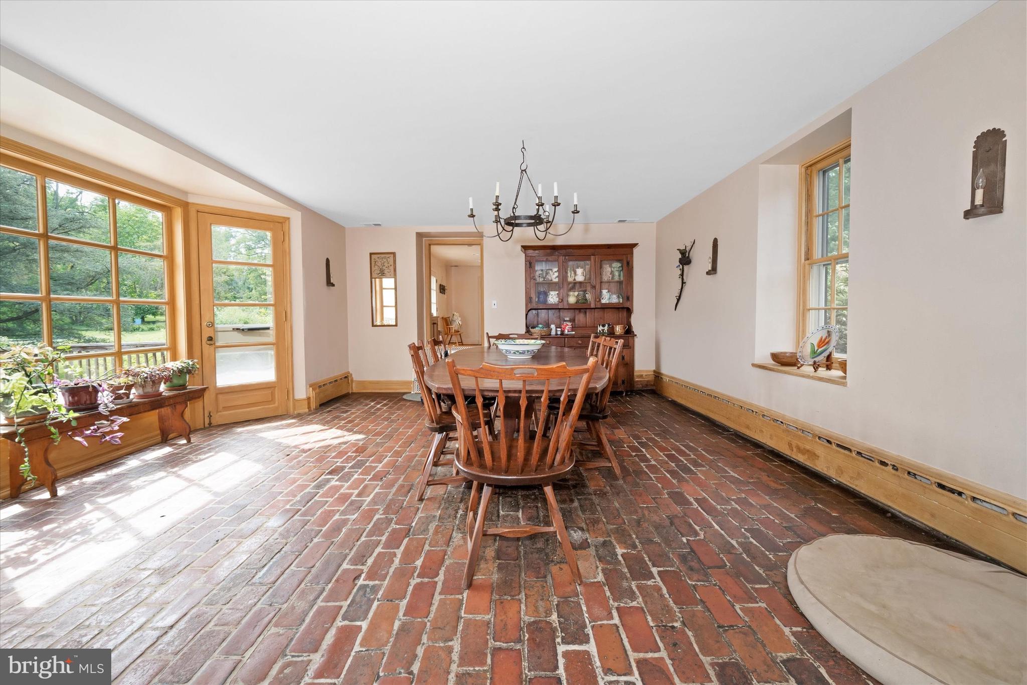 818 Burrows Run Road Chadds Ford, PA 19317 - Photo 11 of 90 a dining room with furniture a chandelier and wooden floor