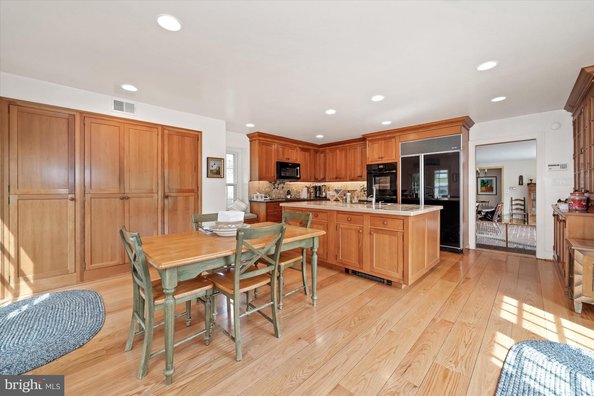 818 Burrows Run Road Chadds Ford, PA 19317 - Photo 14 of 90 a kitchen with stainless steel appliances kitchen island granite countertop a sink and cabinets