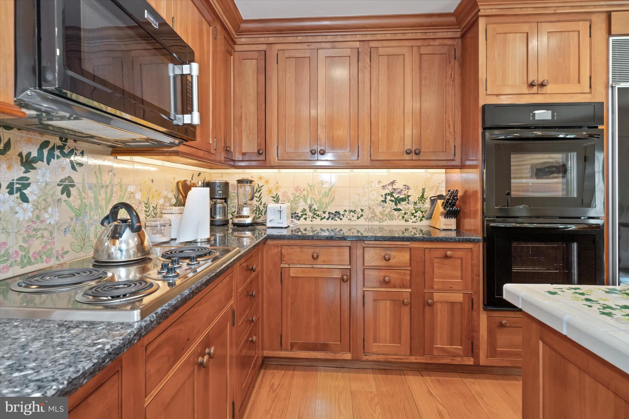 818 Burrows Run Road Chadds Ford, PA 19317 - Photo 18 of 90 a kitchen with granite countertop cabinets stainless steel appliances and a counter space