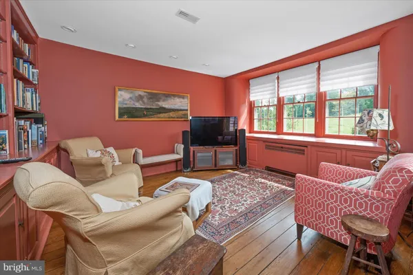 a work room with furniture and rug