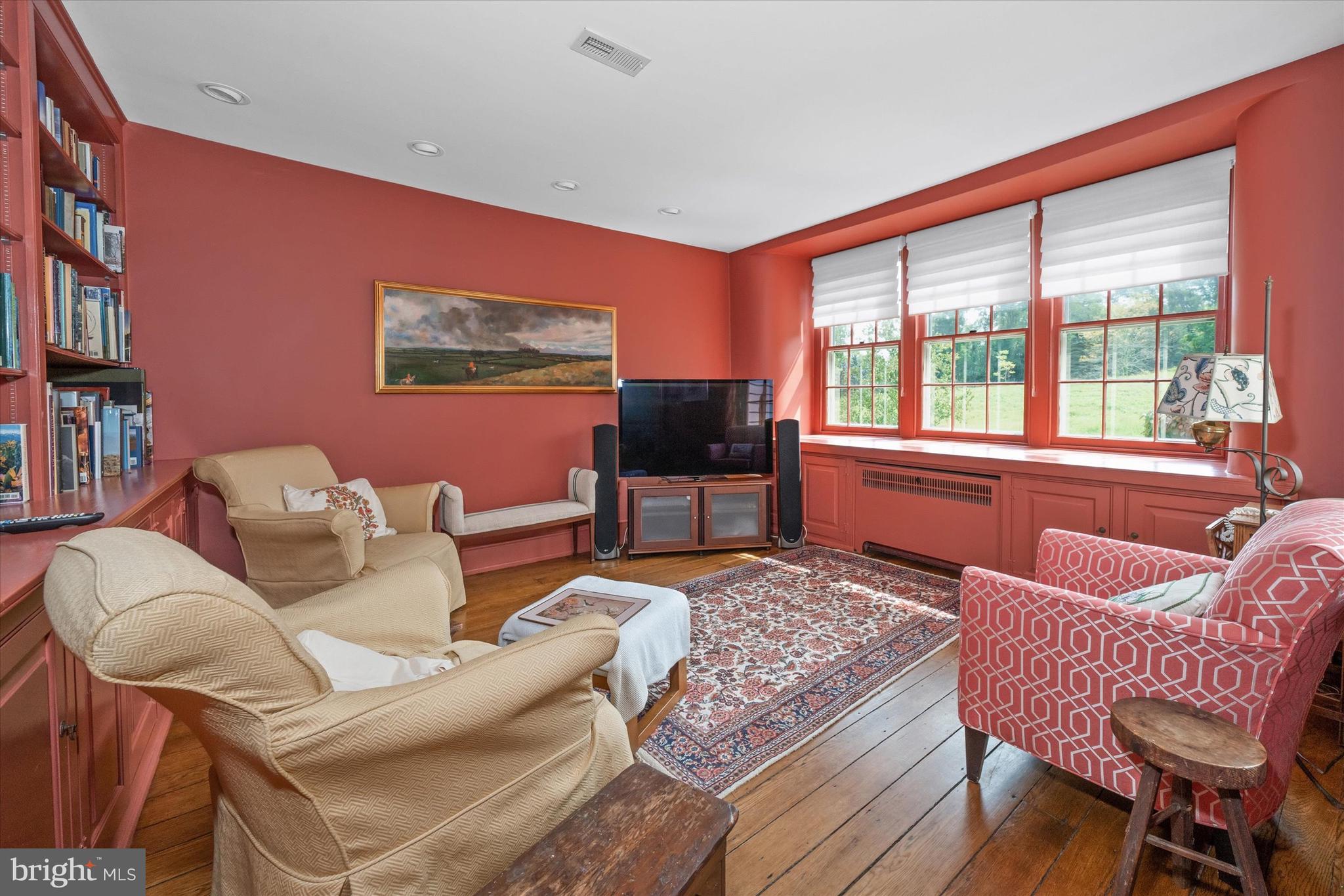 818 Burrows Run Road Chadds Ford, PA 19317 - Photo 20 of 90 a living room with furniture and a flat screen tv