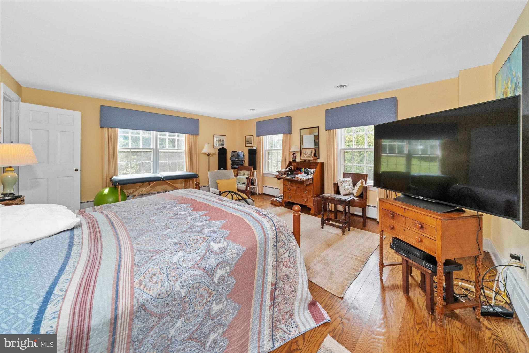 818 Burrows Run Road Chadds Ford, PA 19317 - Photo 22 of 90 a bedroom with a bed and a flat screen tv