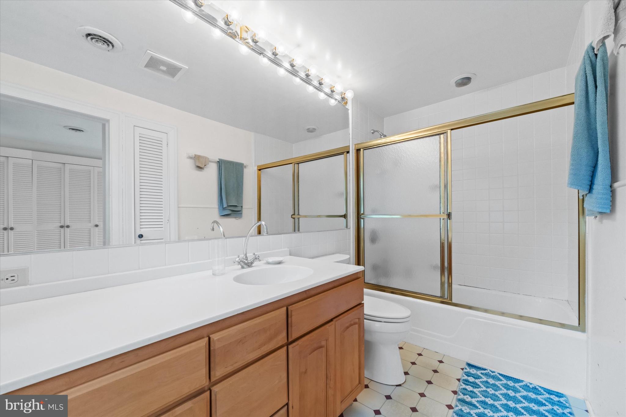 818 Burrows Run Road Chadds Ford, PA 19317 - Photo 25 of 90 a bathroom with a sink a toilet and shower