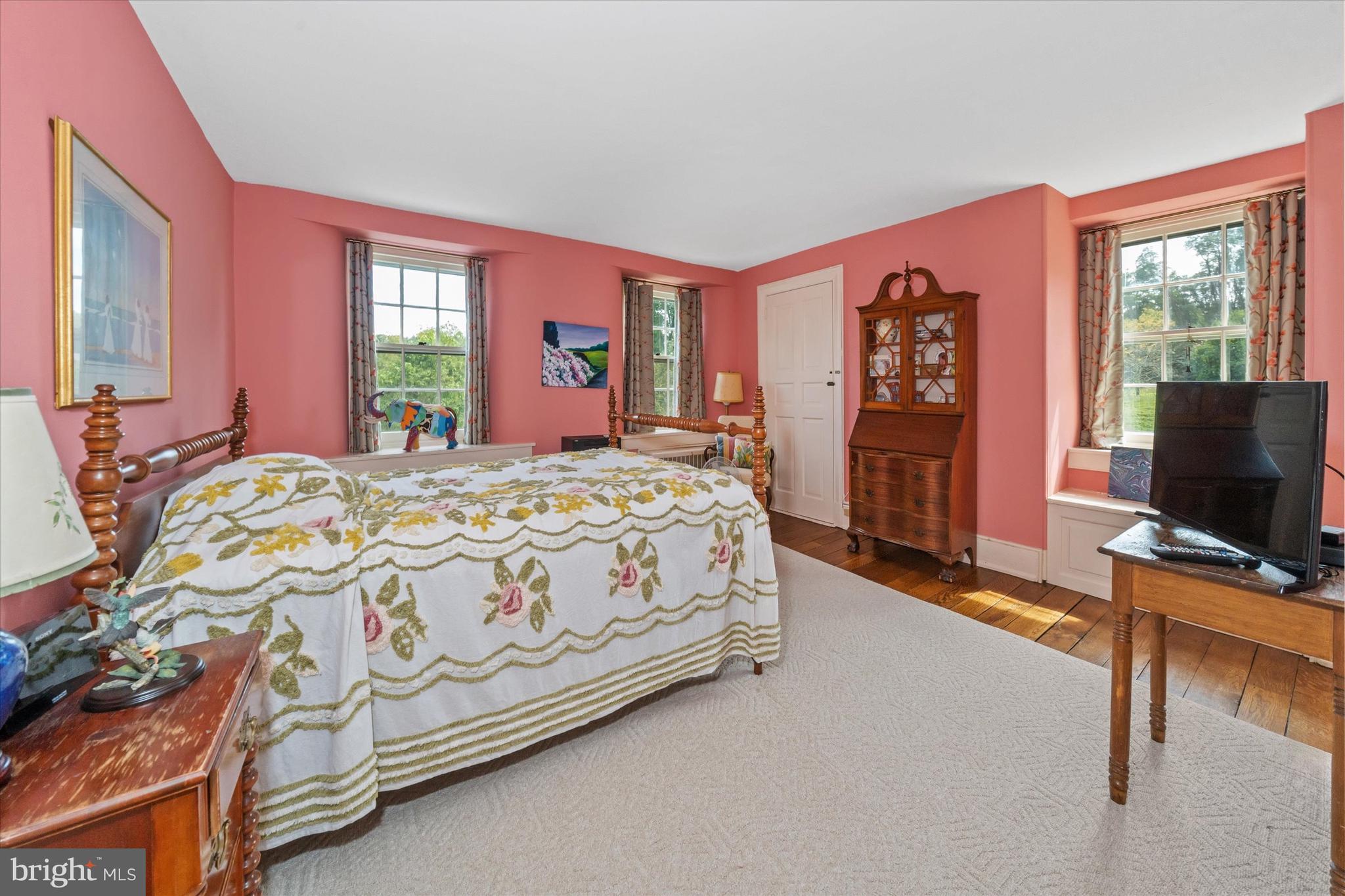 818 Burrows Run Road Chadds Ford, PA 19317 - Photo 27 of 90 a bedroom with a bed and a flat screen tv