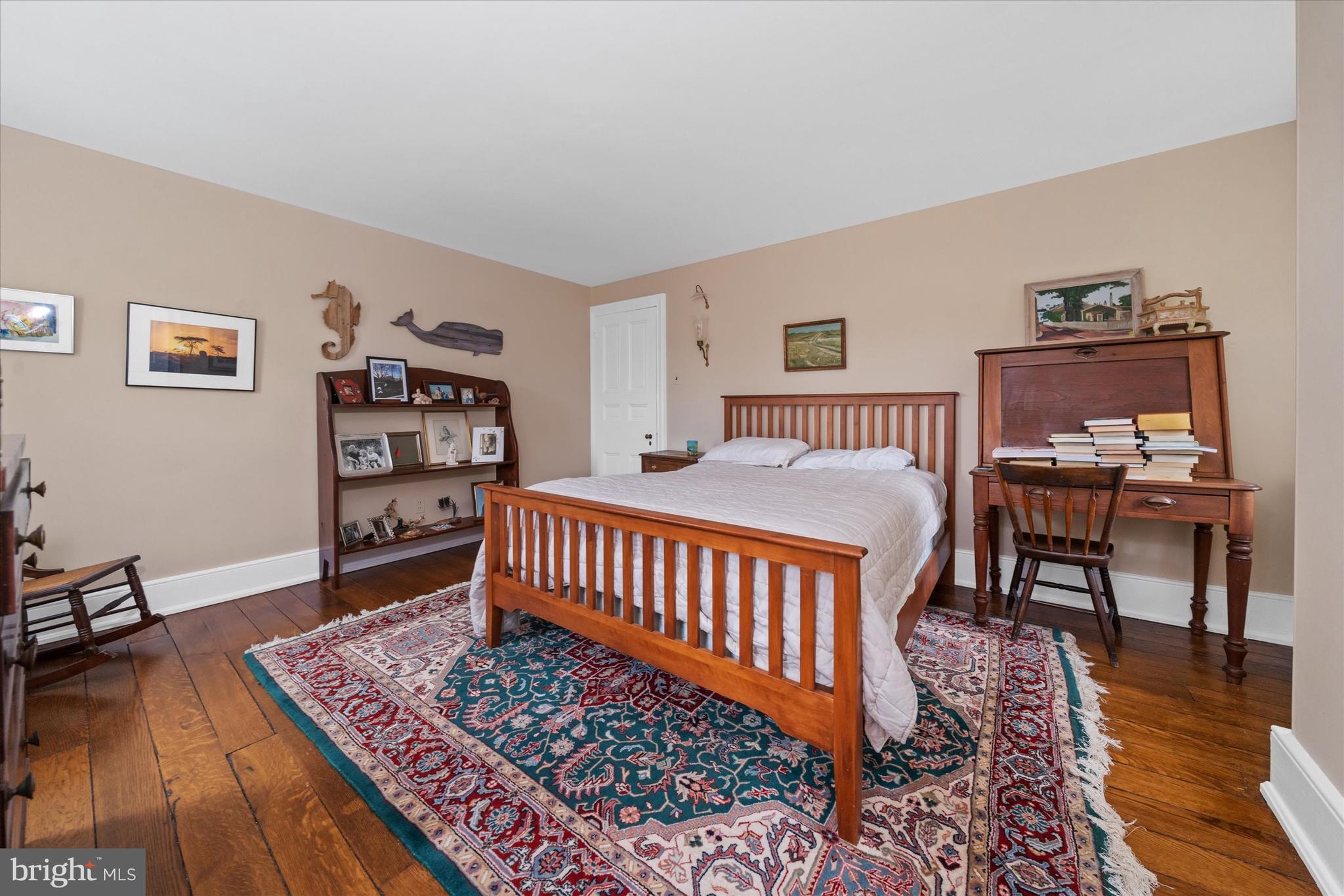 818 Burrows Run Road Chadds Ford, PA 19317 - Photo 29 of 90 a bedroom with furniture and a wooden floor