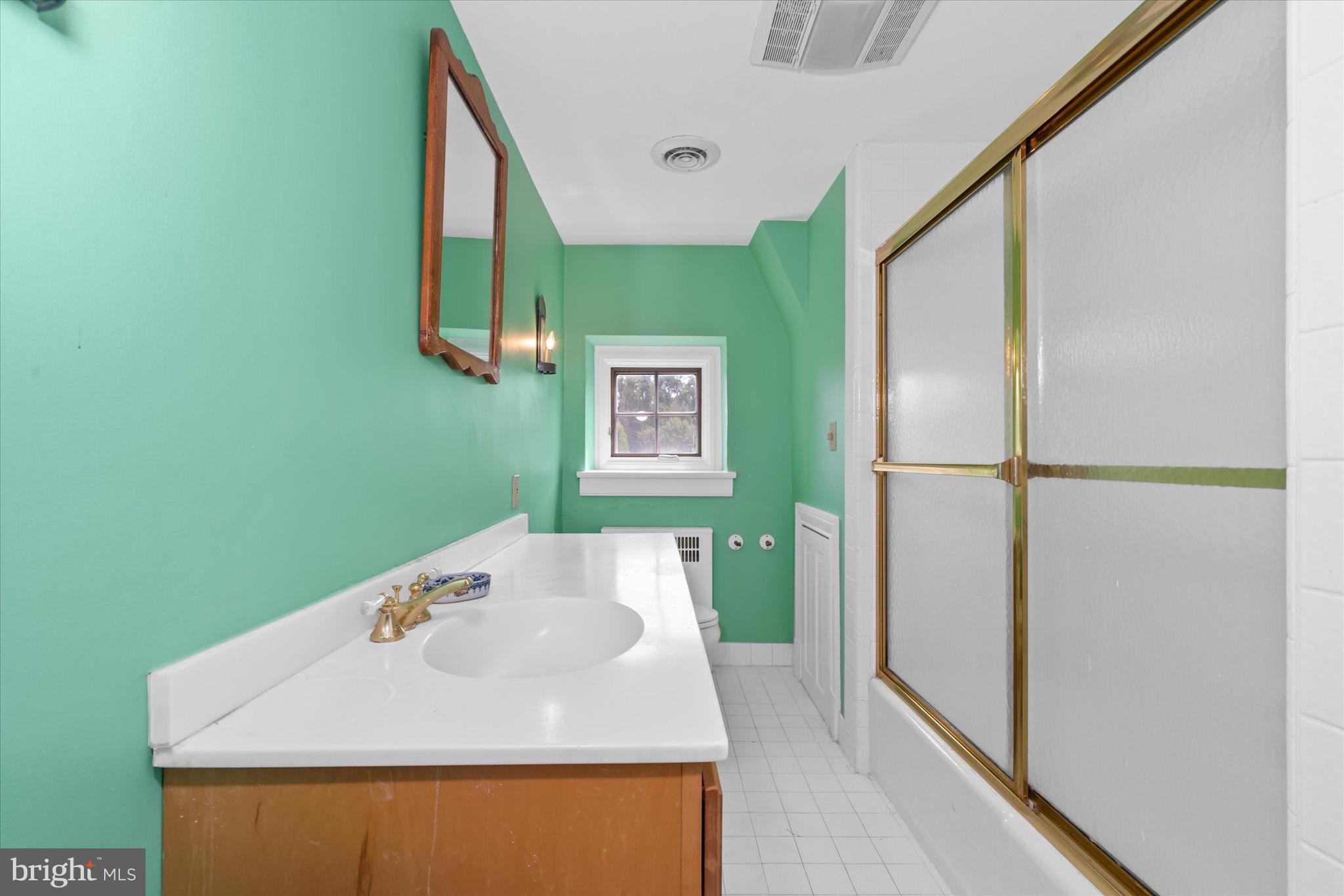 818 Burrows Run Road Chadds Ford, PA 19317 - Photo 42 of 90 a bathroom with a sink and mirror