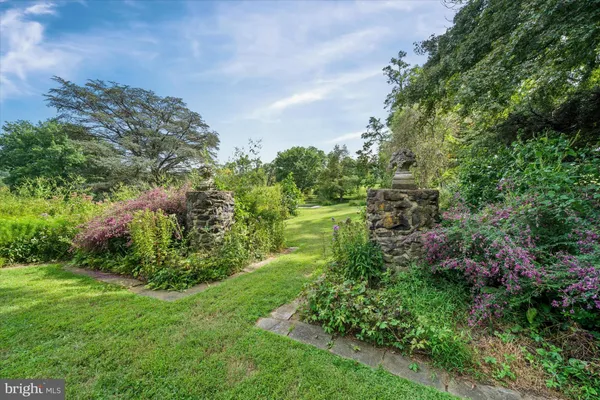 a view of a garden with a lake