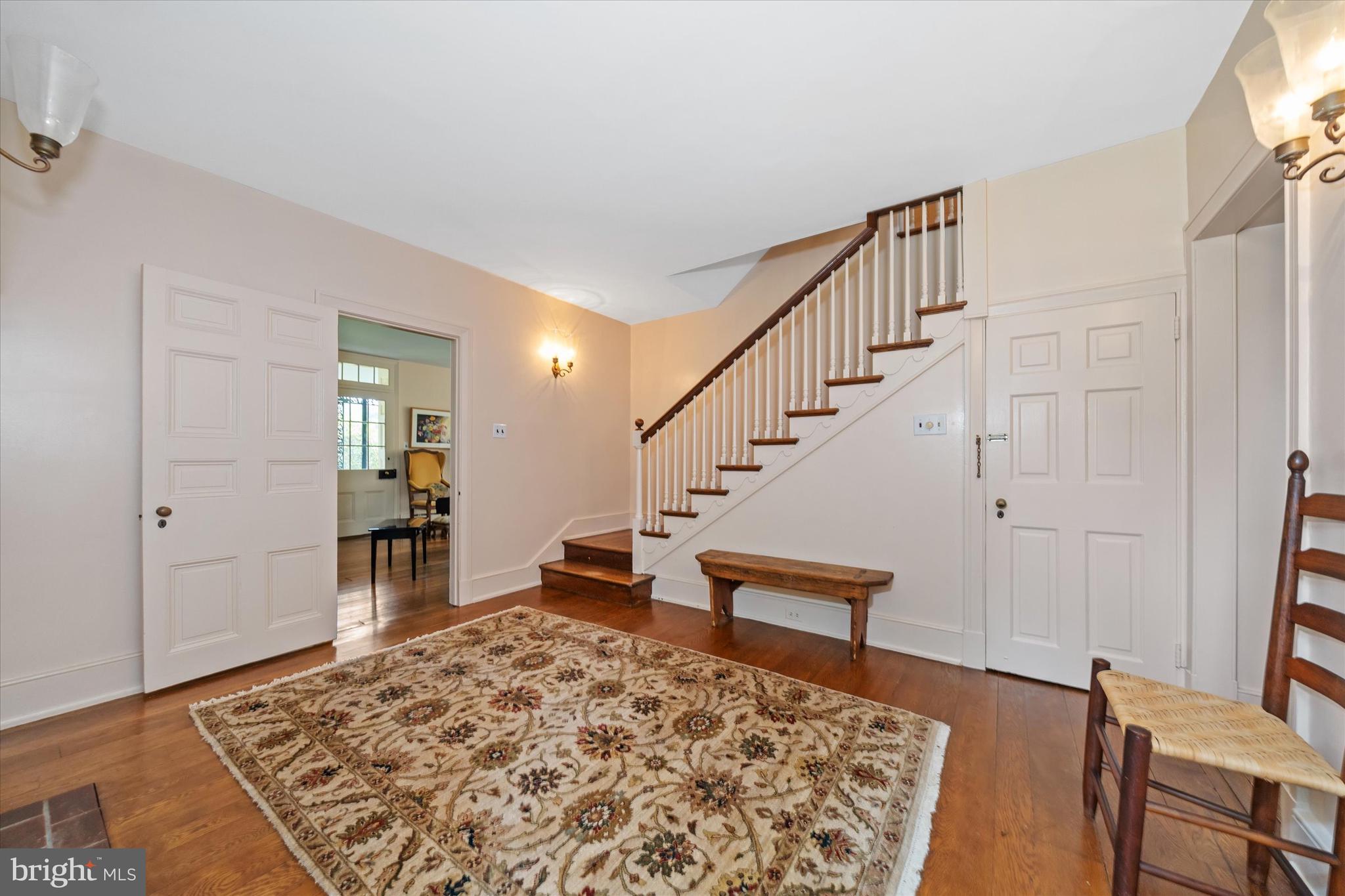 818 Burrows Run Road Chadds Ford, PA 19317 - Photo 5 of 90 a view of a hallway with furniture and a rug