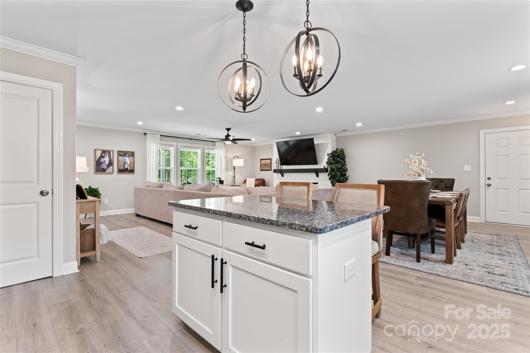 4008 Cypress Circle Lancaster, SC 29720 - Photo 15 of 33 a kitchen with stainless steel appliances granite countertop a stove cabinets and chairs