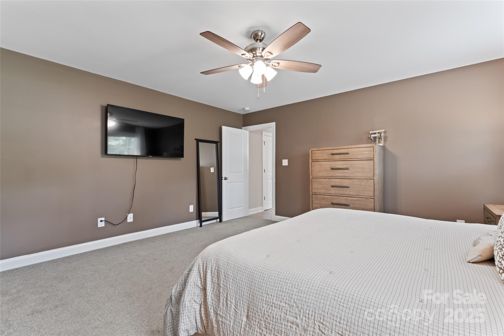 4008 Cypress Circle Lancaster, SC 29720 - Photo 19 of 33 a bedroom with a bed and a flat screen tv