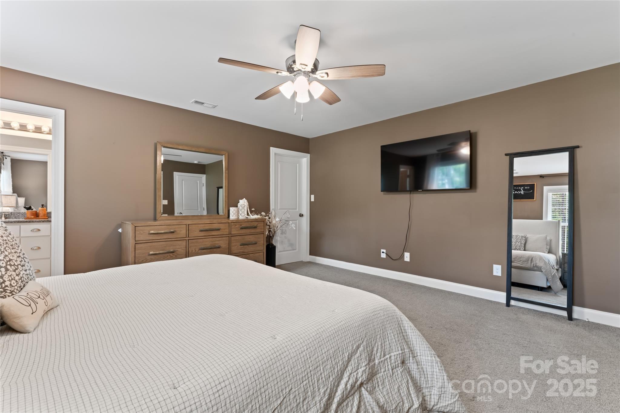 4008 Cypress Circle Lancaster, SC 29720 - Photo 20 of 33 a bedroom with a large bed and a flat tv screen on dresser