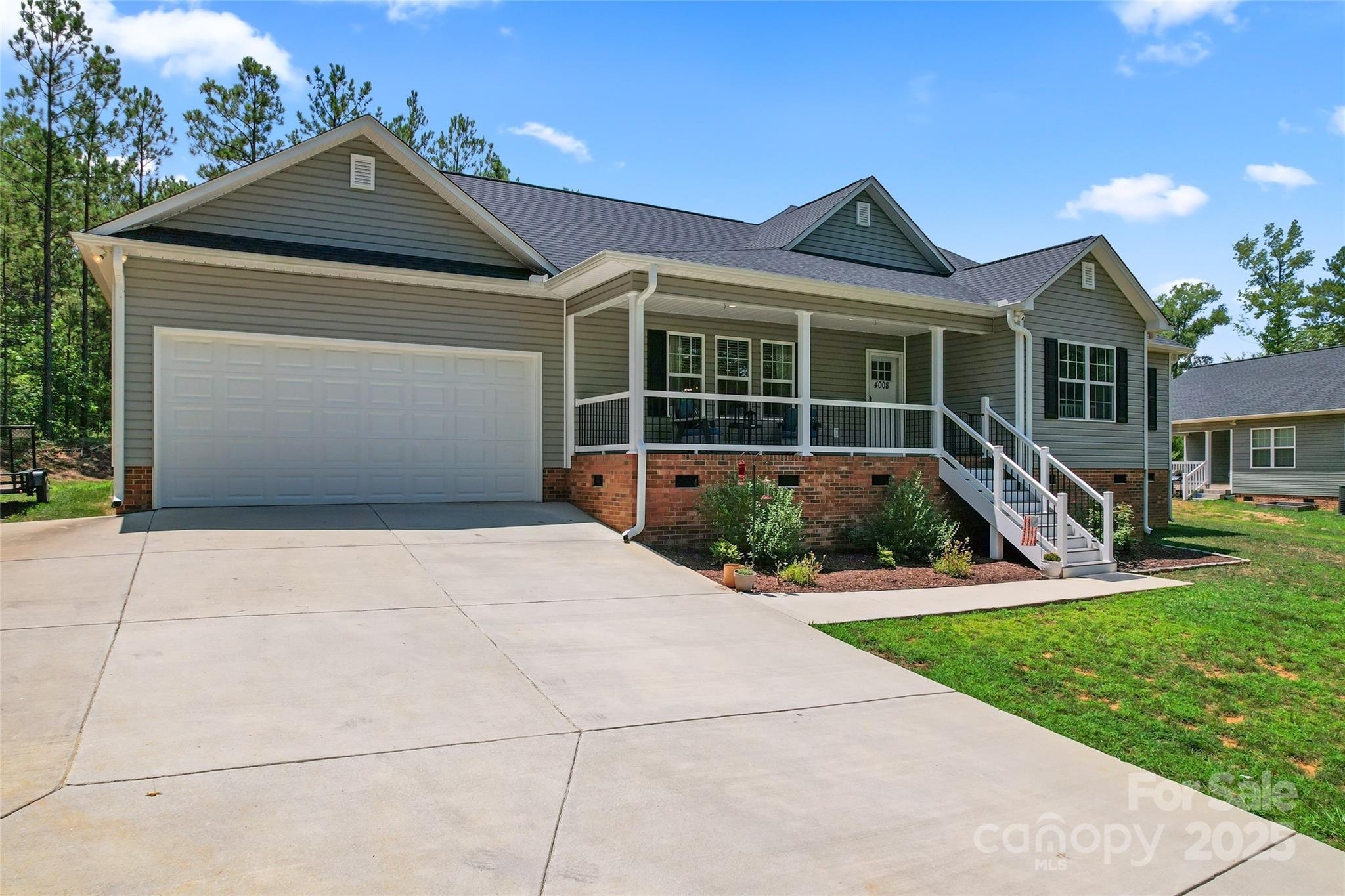 4008 Cypress Circle Lancaster, SC 29720 - Photo 2 of 33 a front view of a house with a yard and potted plants
