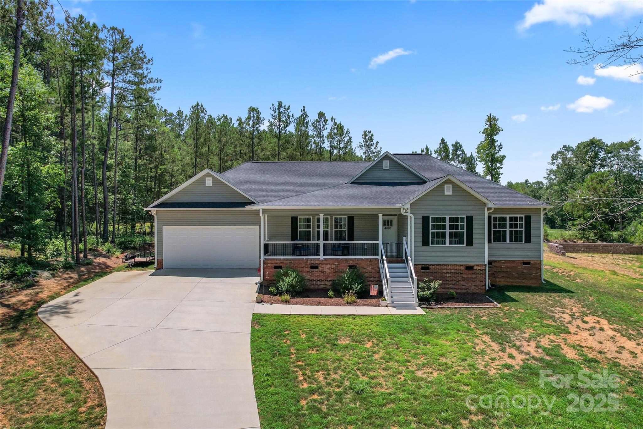 4008 Cypress Circle Lancaster, SC 29720 - Photo 3 of 33 a front view of a house with a yard and trees
