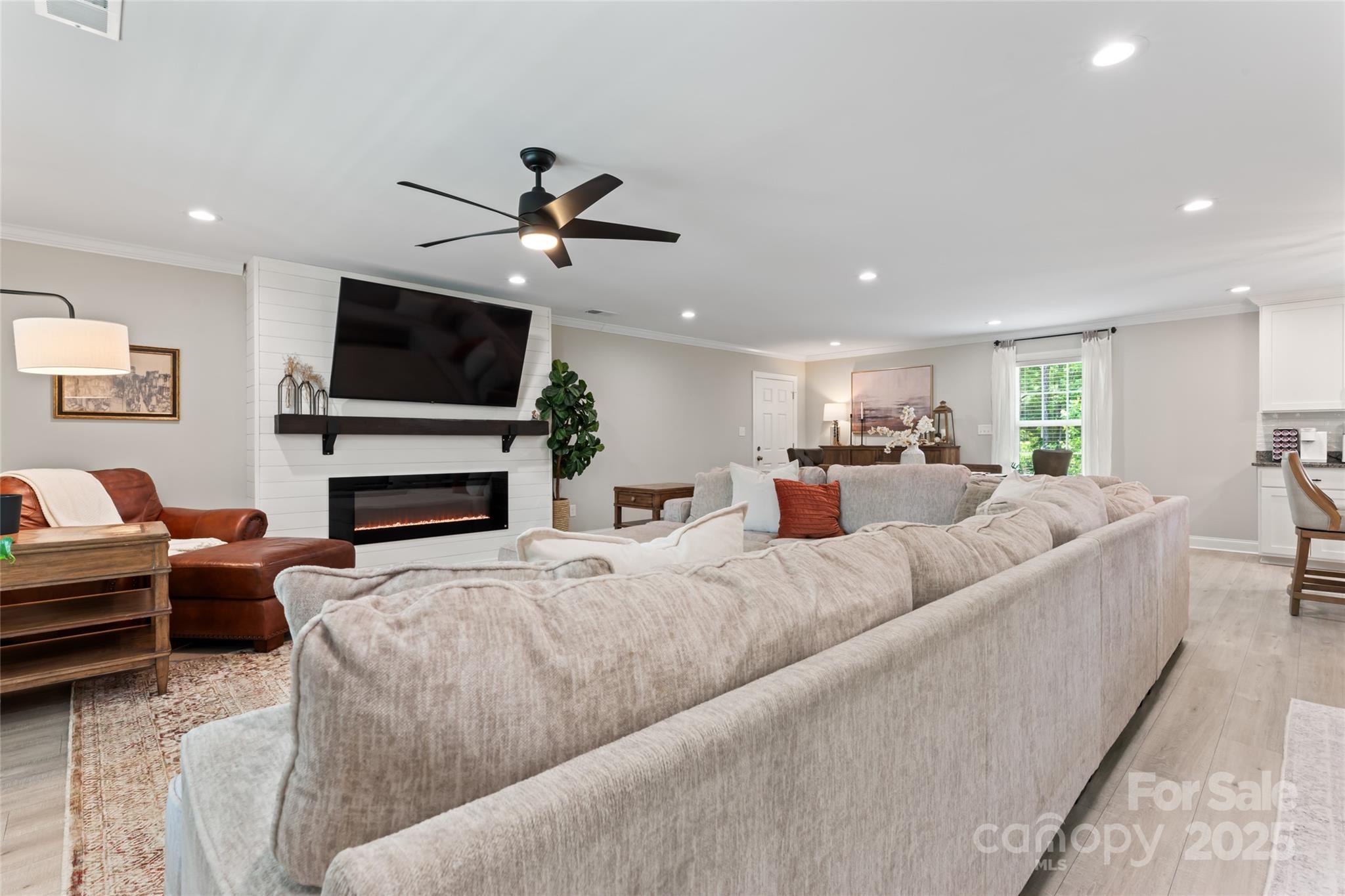 4008 Cypress Circle Lancaster, SC 29720 - Photo 5 of 33 a living room with furniture a flat screen tv and a fireplace