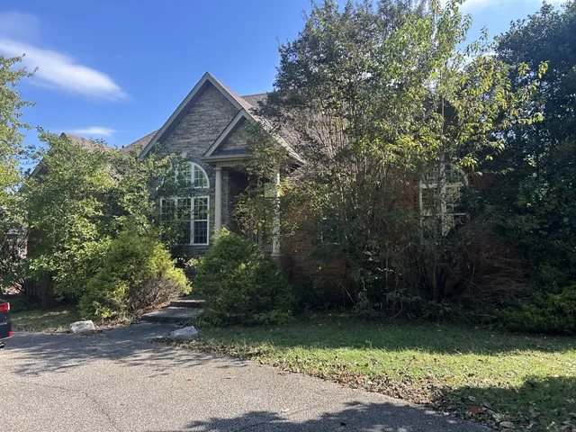 a front view of a house with garden