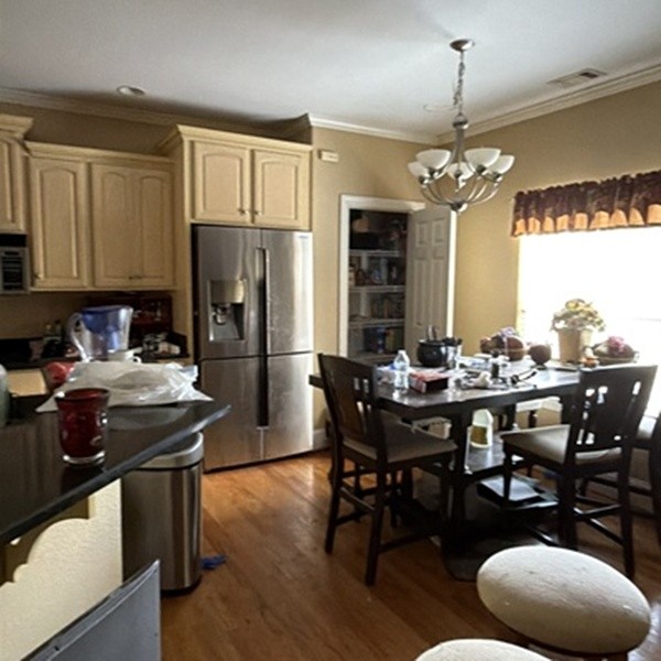 1812 Pointe Court Lebanon, TN 37087 - Photo 12 of 25 a kitchen with stainless steel appliances granite countertop a stove a refrigerator a kitchen island a dining table and chairs