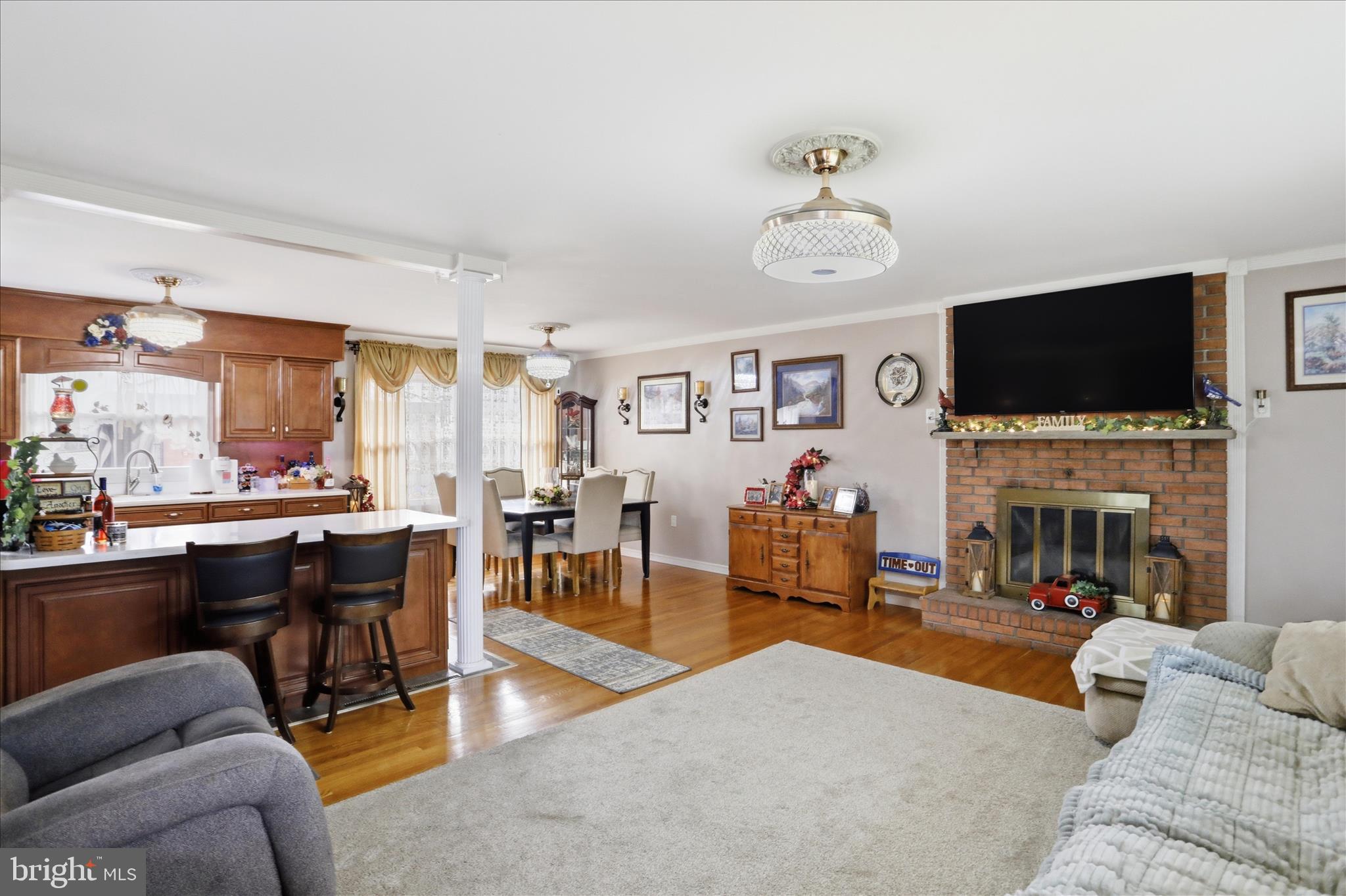 14704 Main Street Cresaptown, MD 21502 - Photo 15 of 58 a living room with fireplace furniture and a flat screen tv