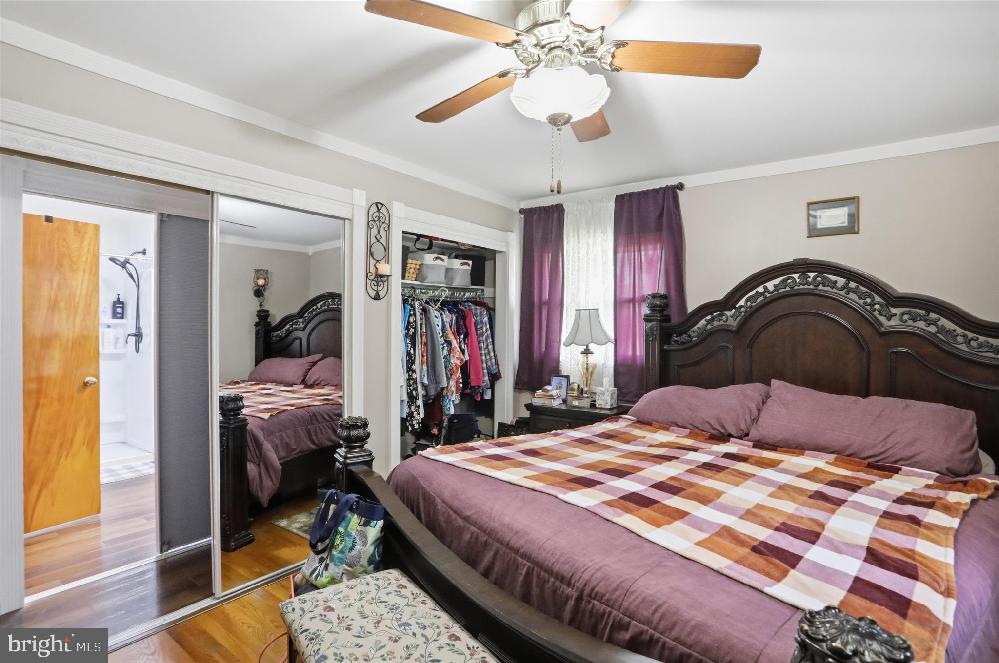 14704 Main Street Cresaptown, MD 21502 - Photo 23 of 58 a bedroom with a bed and a chandelier