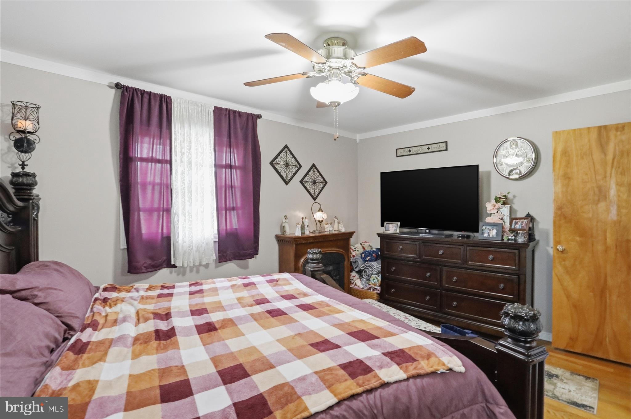 14704 Main Street Cresaptown, MD 21502 - Photo 24 of 58 a bedroom with a bed and a flat screen tv