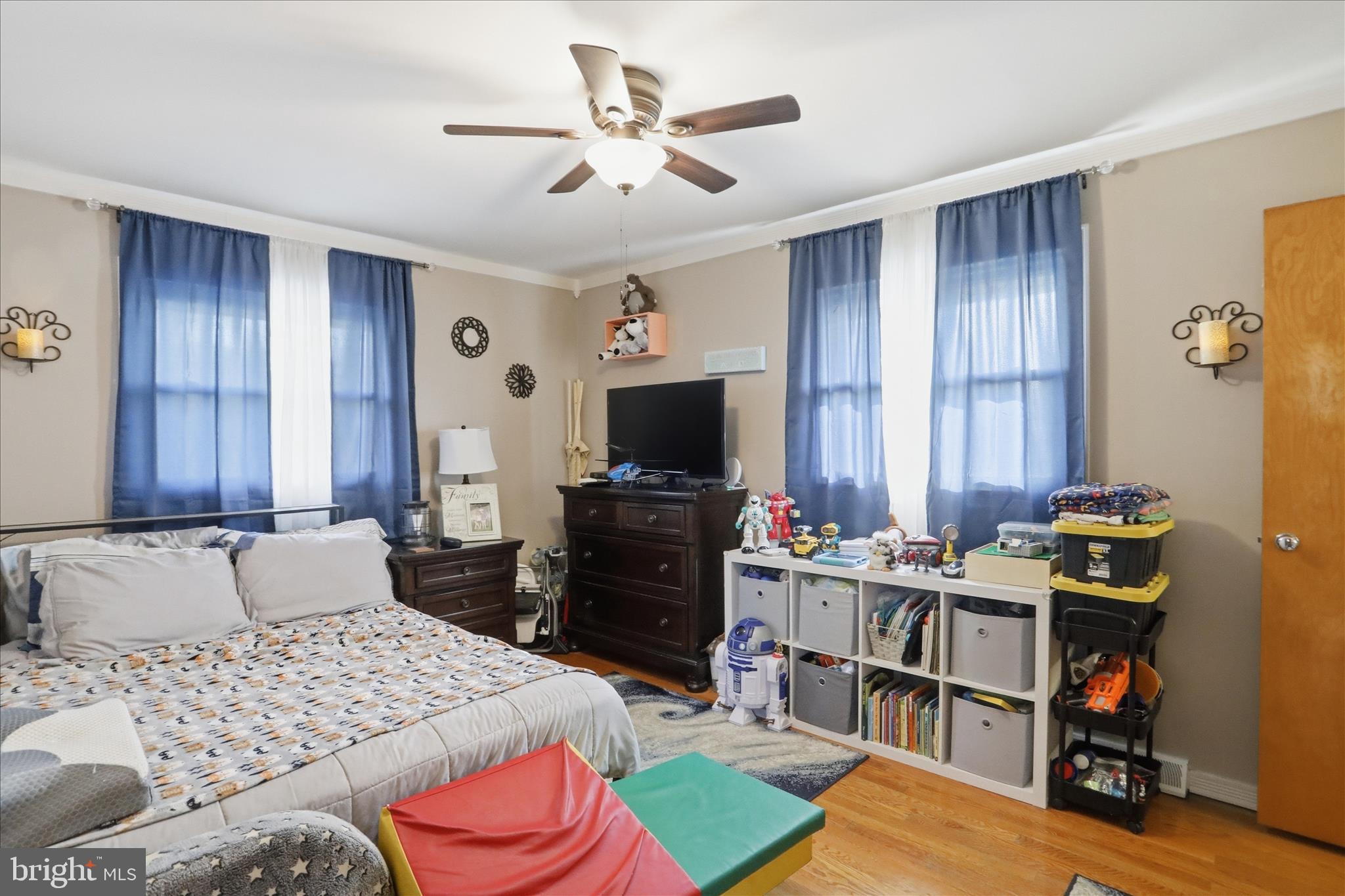 14704 Main Street Cresaptown, MD 21502 - Photo 26 of 58 a bedroom with a bed and a television