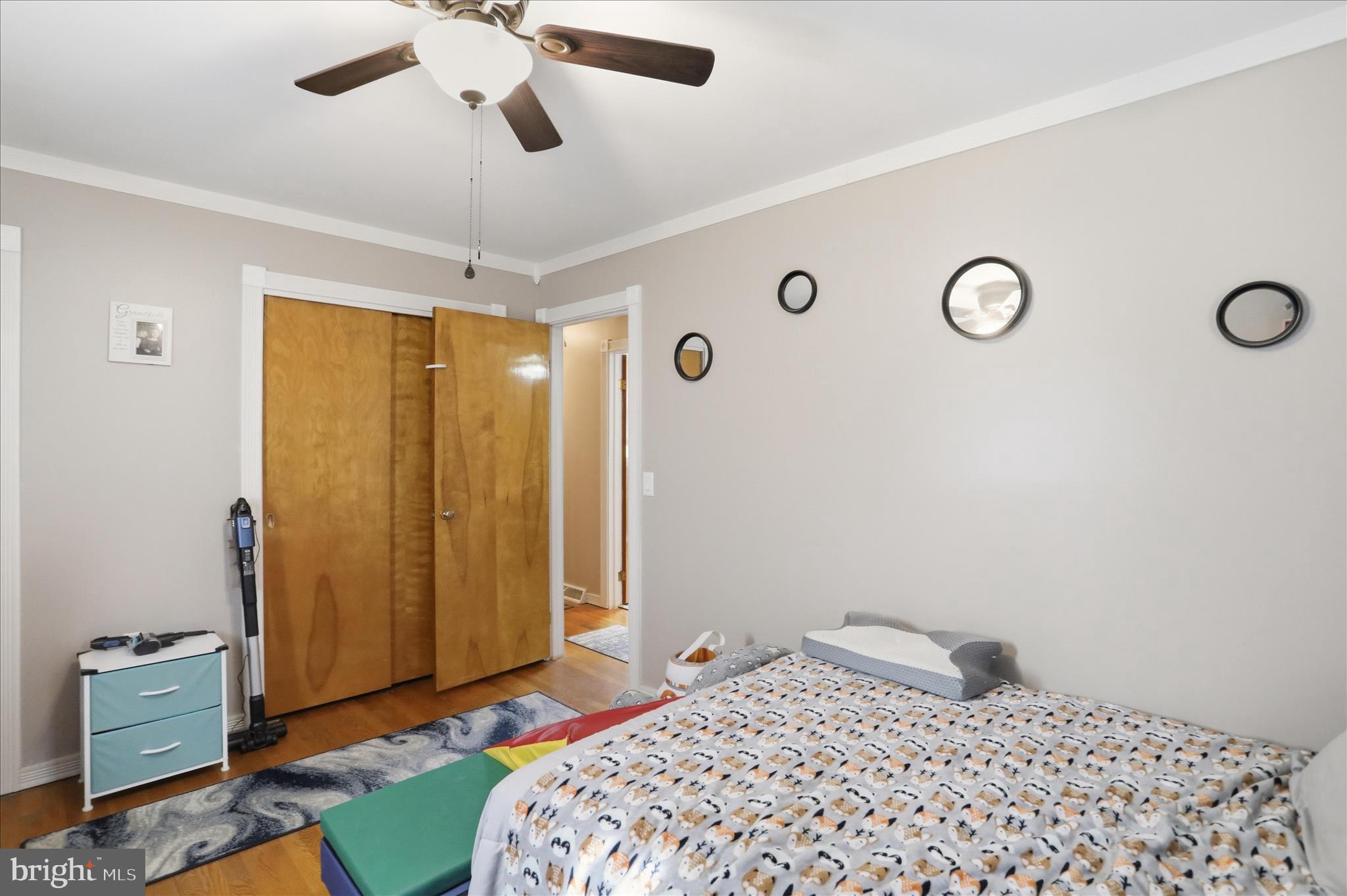 14704 Main Street Cresaptown, MD 21502 - Photo 27 of 58 a bedroom with a bed and a chandelier