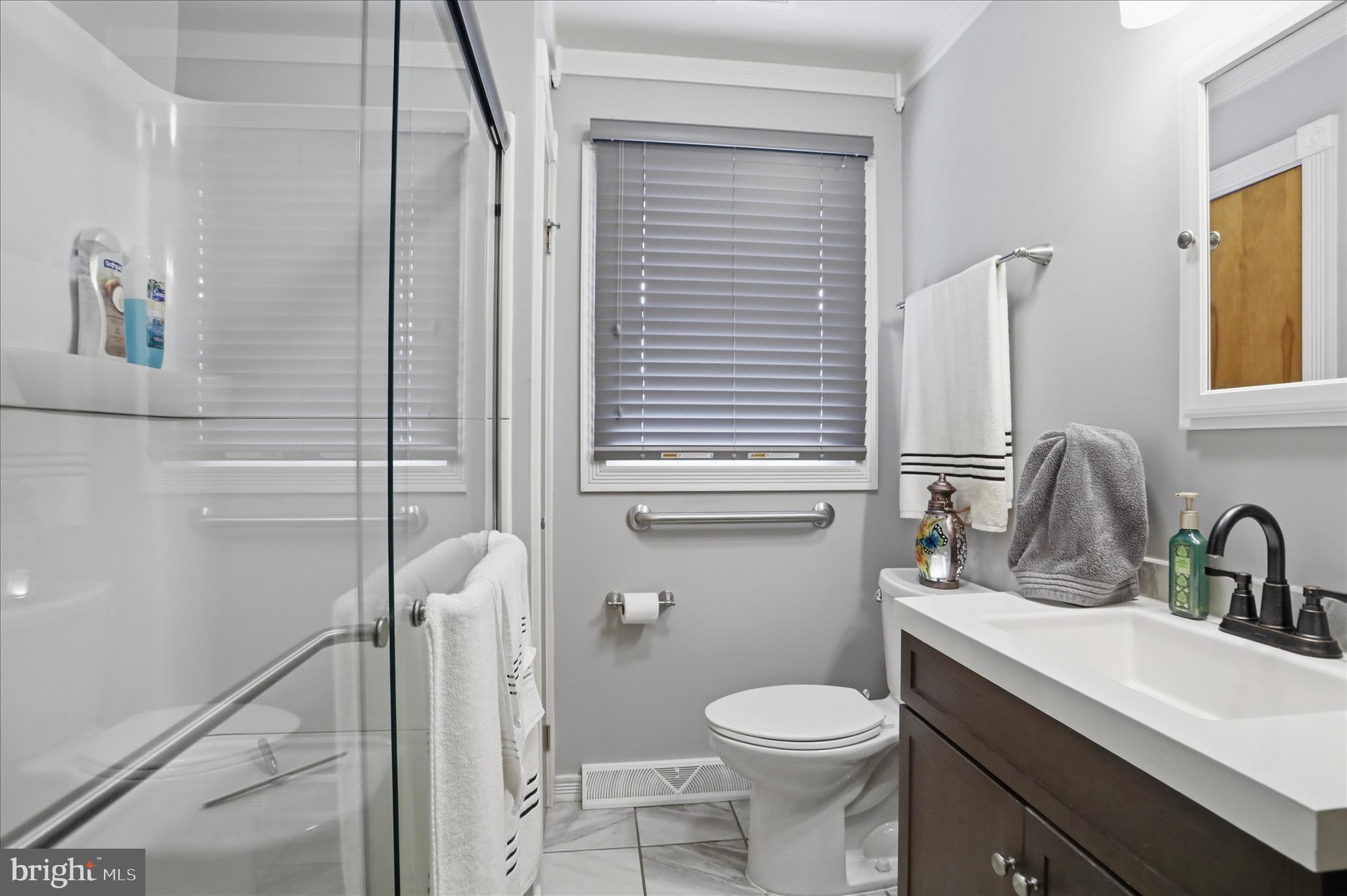14704 Main Street Cresaptown, MD 21502 - Photo 29 of 58 a bathroom with a sink a toilet and shower