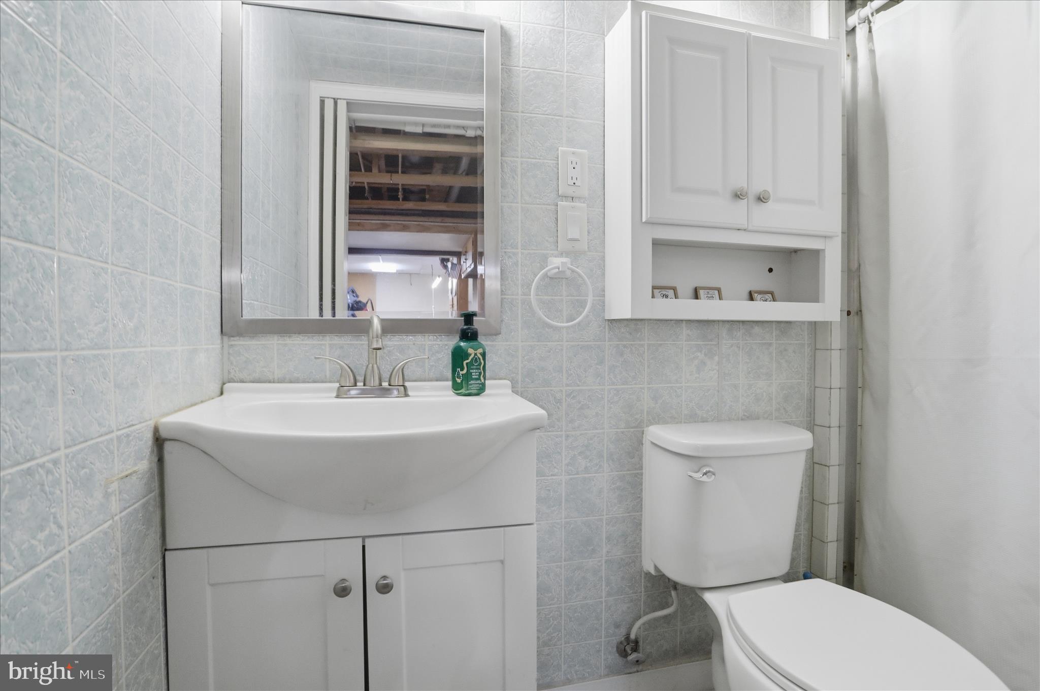 14704 Main Street Cresaptown, MD 21502 - Photo 34 of 58 a bathroom with a sink a toilet and mirror