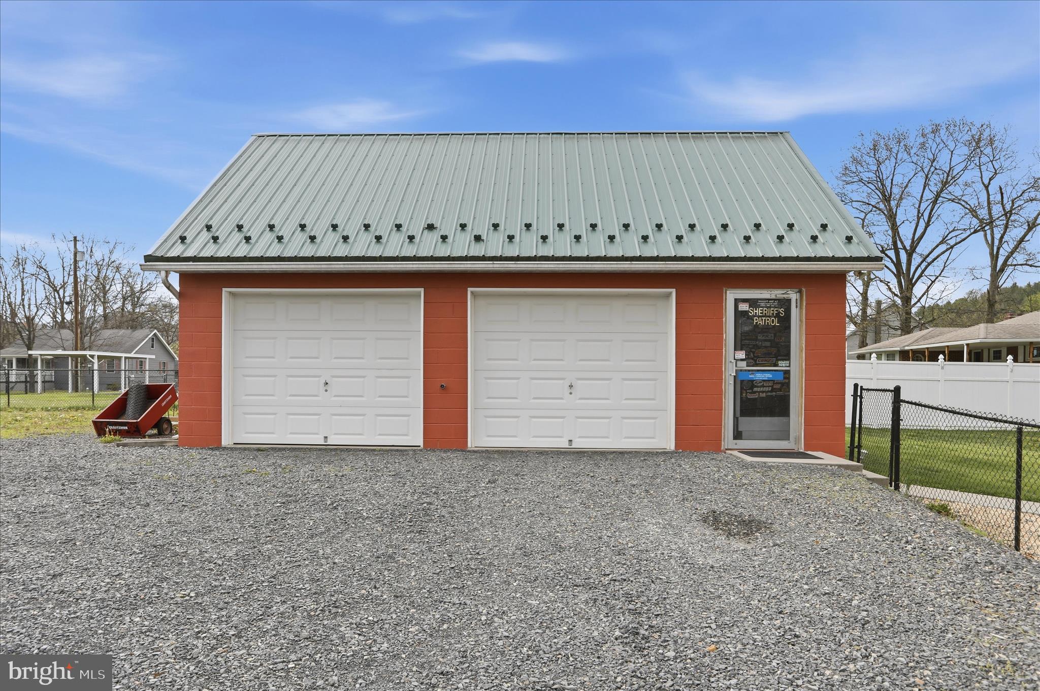 14704 Main Street Cresaptown, MD 21502 - Photo 5 of 58 a front view of a house with a garage