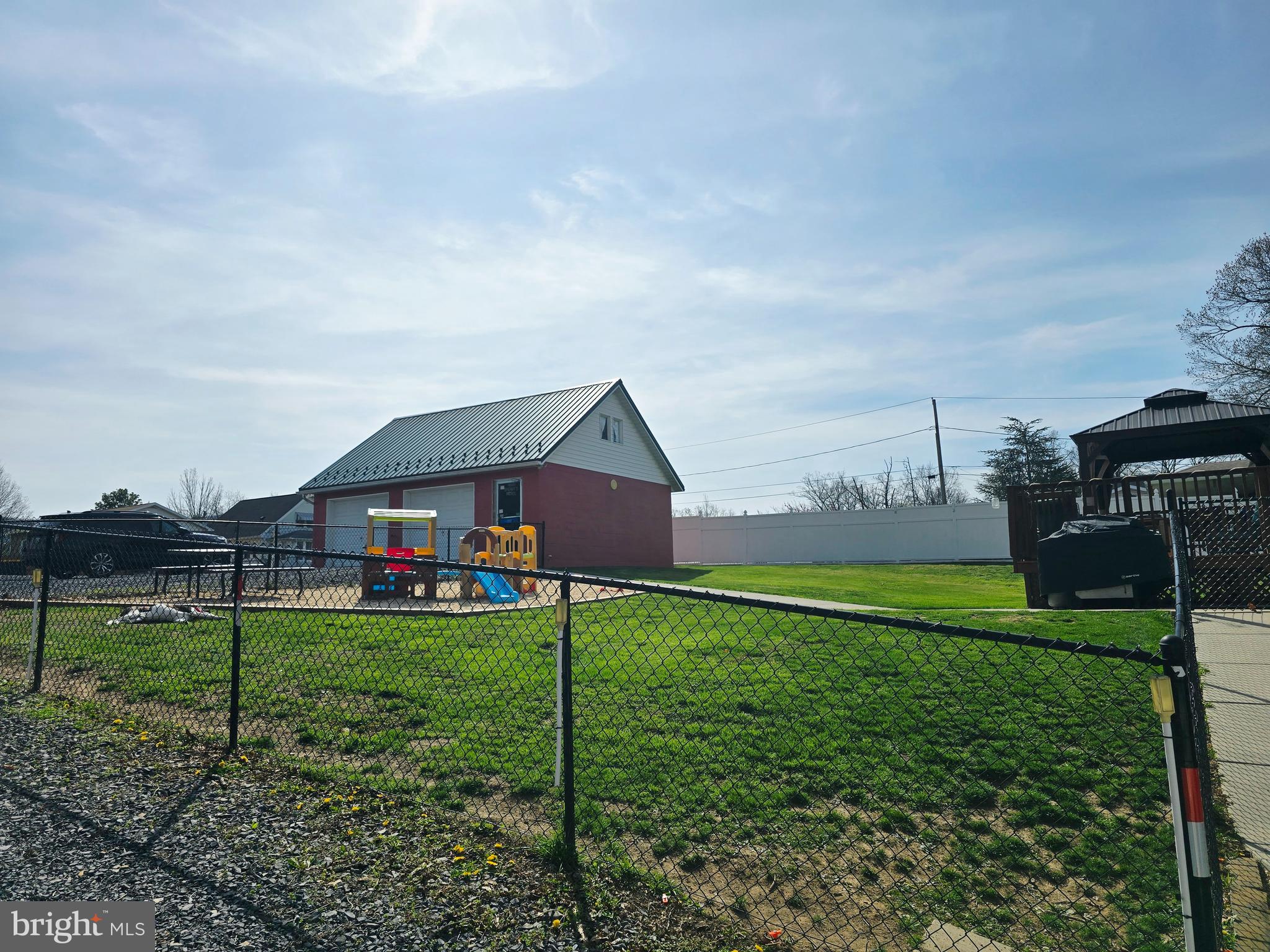 14704 Main Street Cresaptown, MD 21502 - Photo 57 of 58 a house view with a play ground in front of it