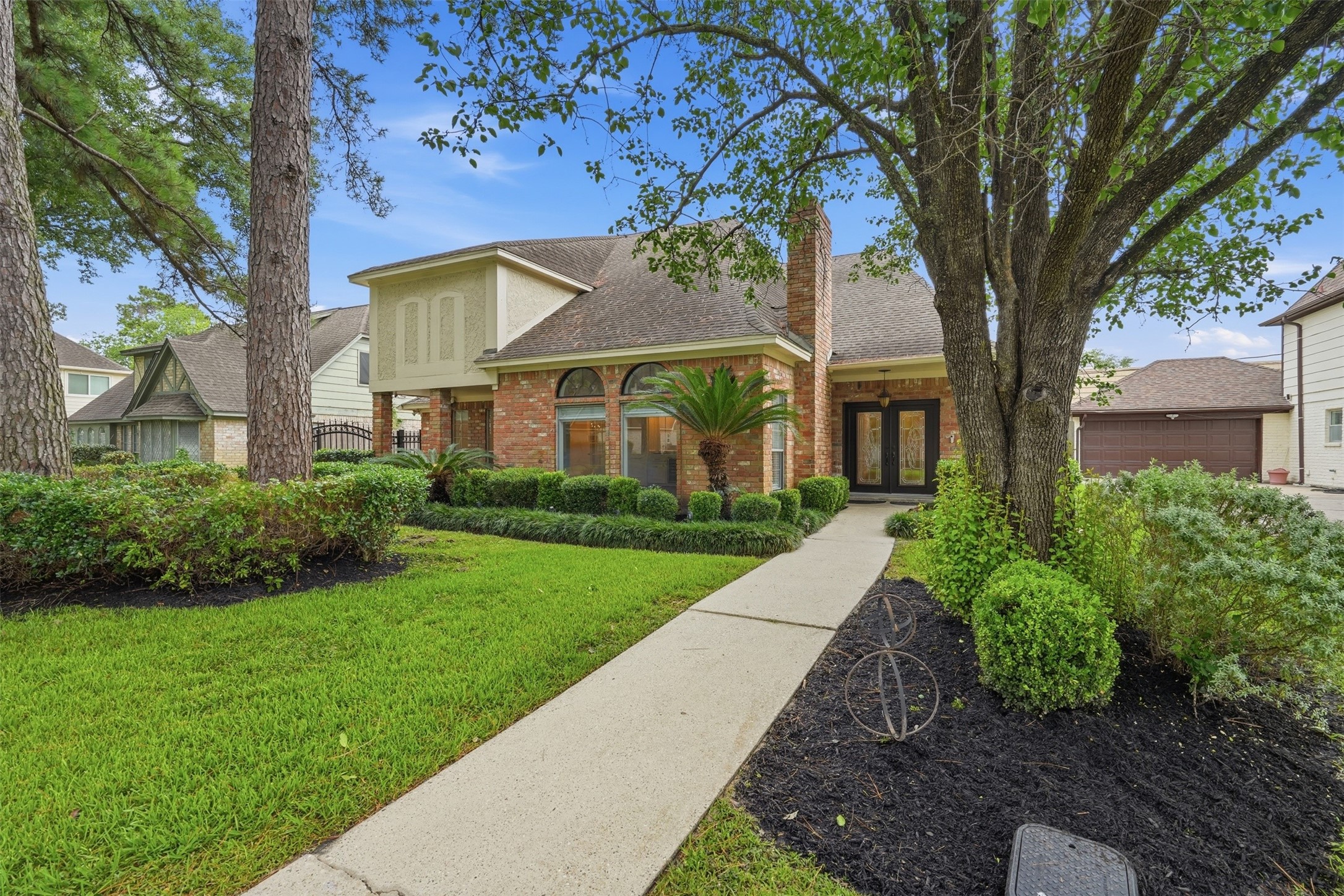 8310 Mentmore Drive Spring, TX 77379 - Photo 1 of 47 Welcome to 8310 Mentmore Drive, where timeless curb appeal, mature landscaping, and an inviting front elevation create a memorable first impression.