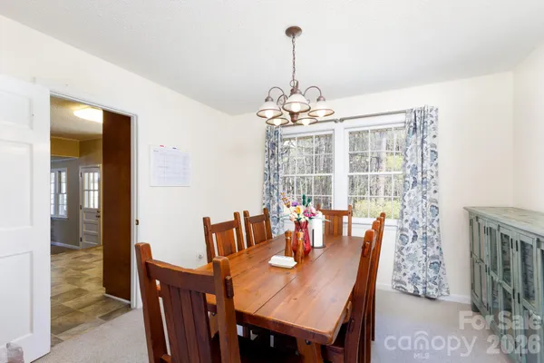 a kitchen with granite countertop a sink dishwasher stove and cabinets