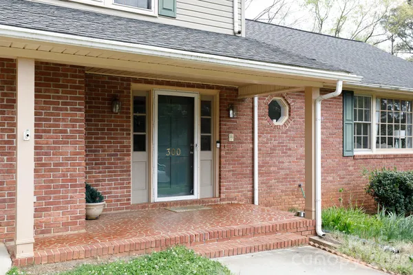 a view of a brick house with a large windows