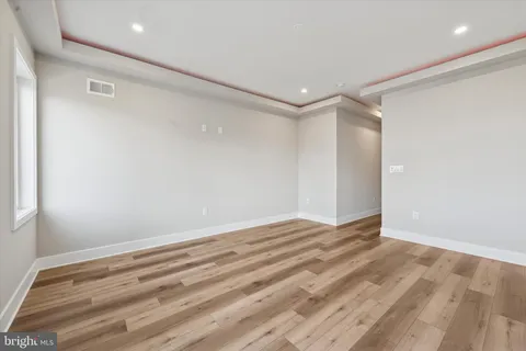 a view of room with wooden floor