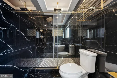 a bathroom with a toilet and a sink