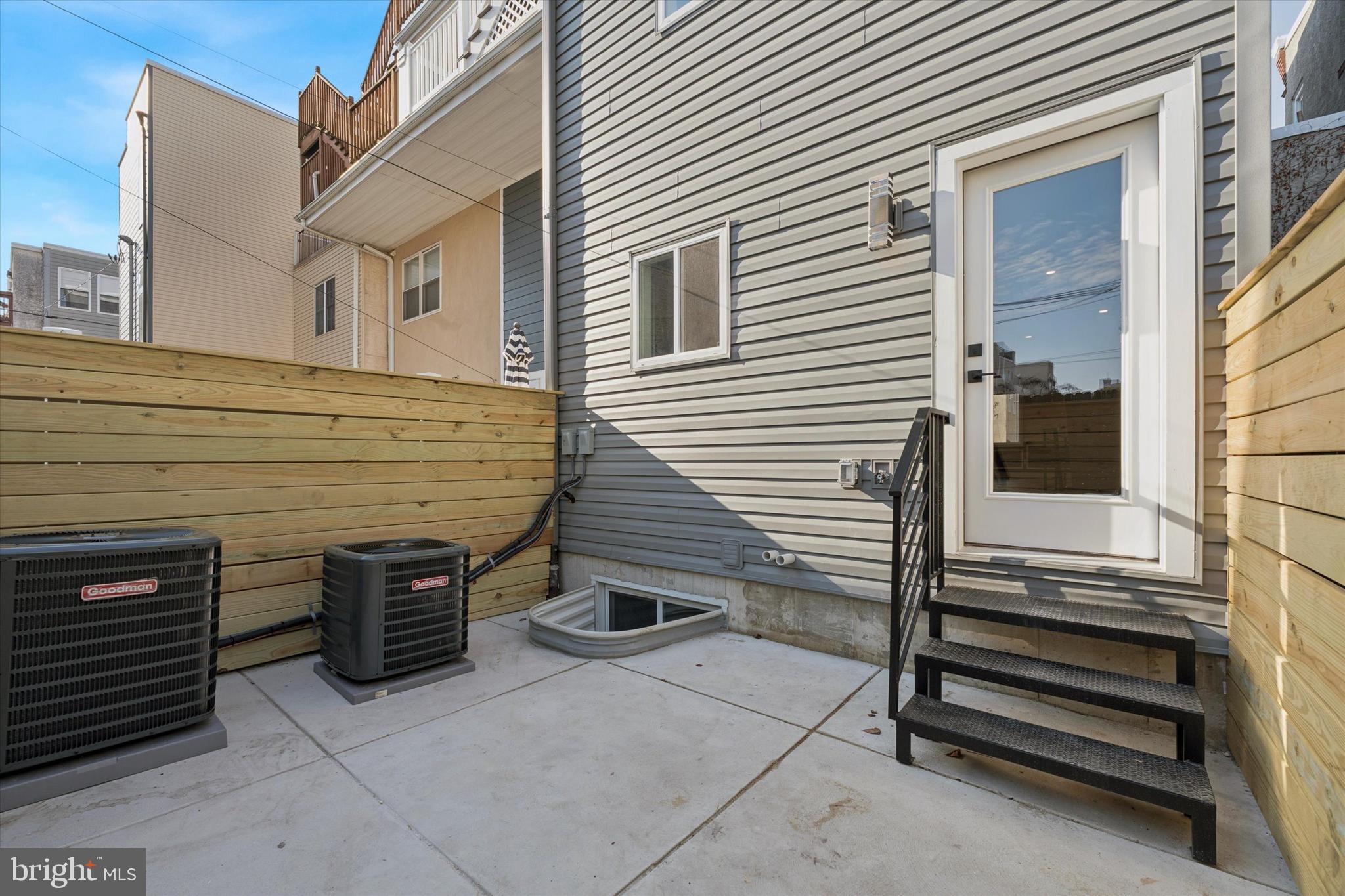 1203 South 18th Street Philadelphia, PA 19146 - Photo 25 of 25 a view of a house with a barbeque and wooden stairs