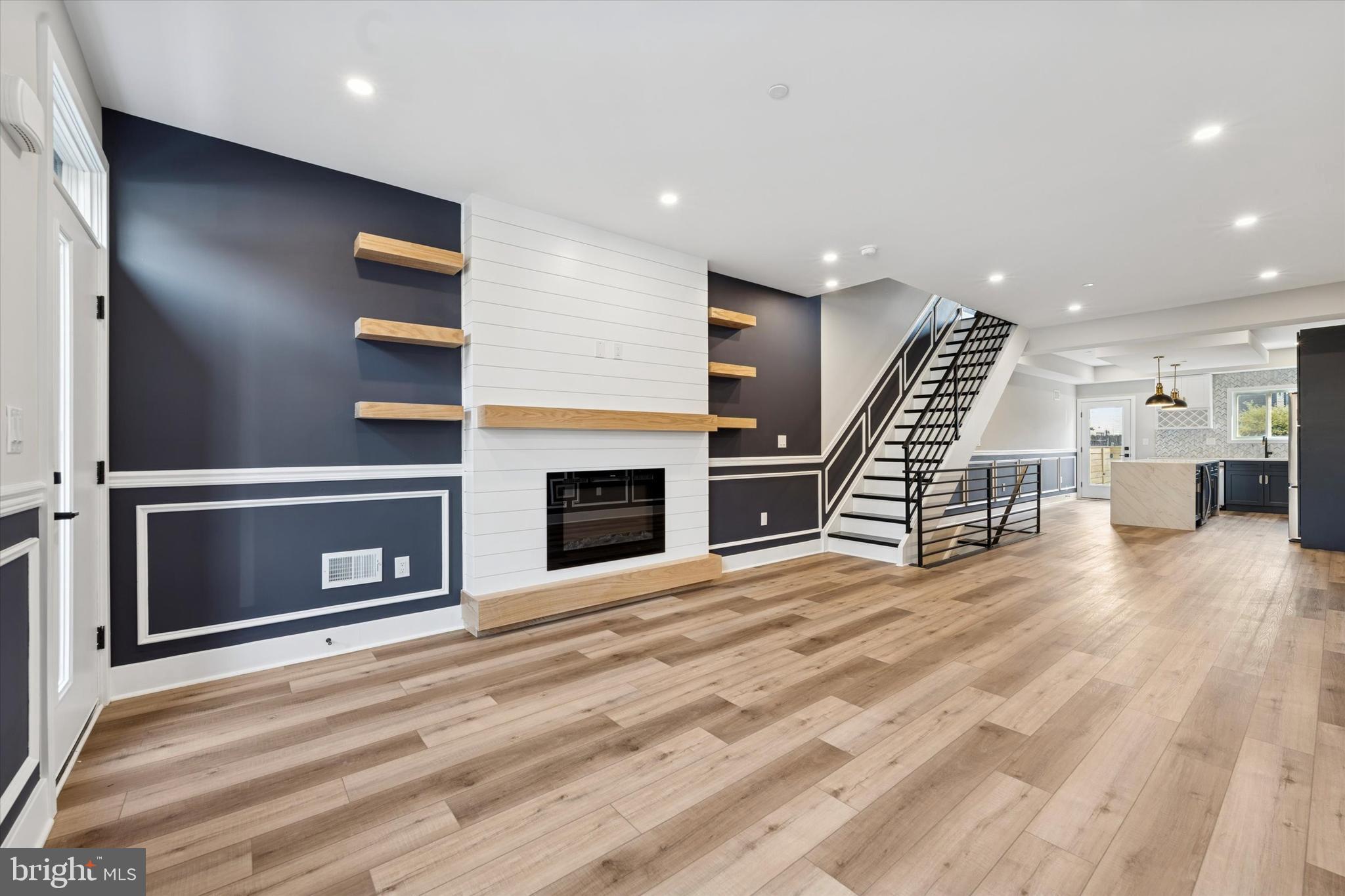 1203 South 18th Street Philadelphia, PA 19146 - Photo 3 of 25 a view of a livingroom with wooden floor and staircase