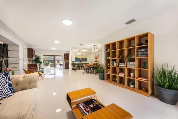 a living room with furniture and a window