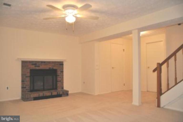 11510 Underoak Court Reston, VA 20191 - Photo 15 of 30 Doors to powder room, laundry. Storage near stairs