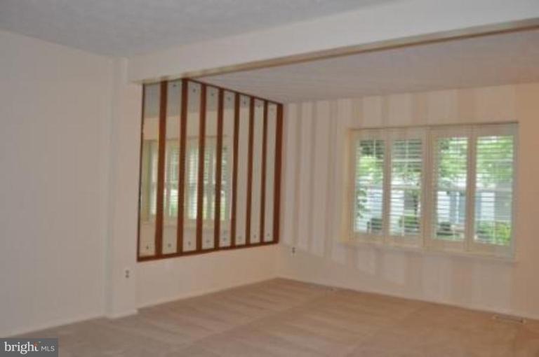 11510 Underoak Court Reston, VA 20191 - Photo 24 of 30 17 x 12 living room has plantation shutters.