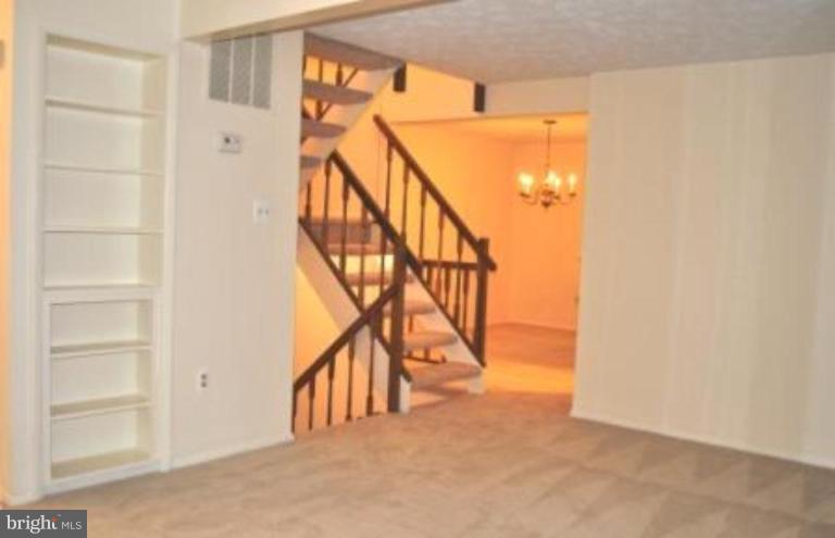 11510 Underoak Court Reston, VA 20191 - Photo 25 of 30 Built-in bookshelves and open stairs.