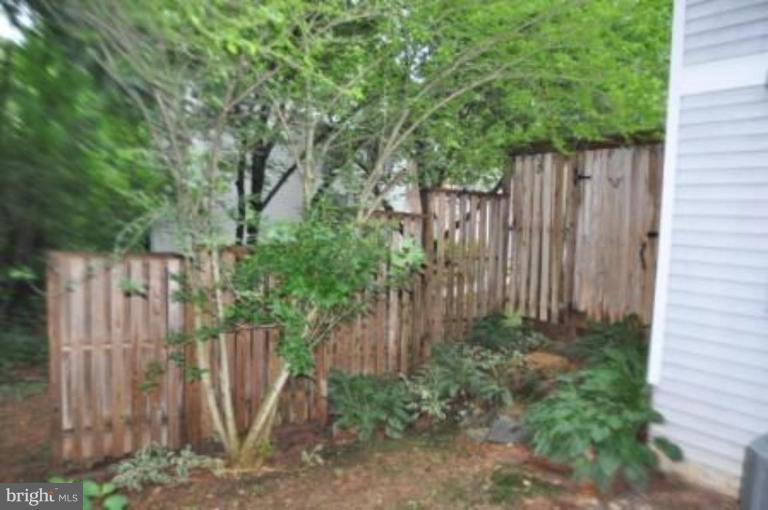 11510 Underoak Court Reston, VA 20191 - Photo 30 of 30 Fenced storage area at read side of home.