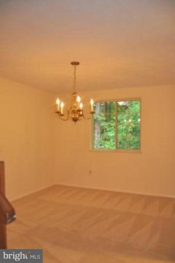 11510 Underoak Court Reston, VA 20191 - Photo 10 of 30 12 x 10 dining room with brass chandelier.