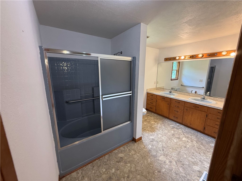 4250 AR 7 Jasper, AR 72641 - Photo 3 of 47 Bathroom featuring a dual vanity with wood cabinetry, a large mirror, and overhead strip lighting