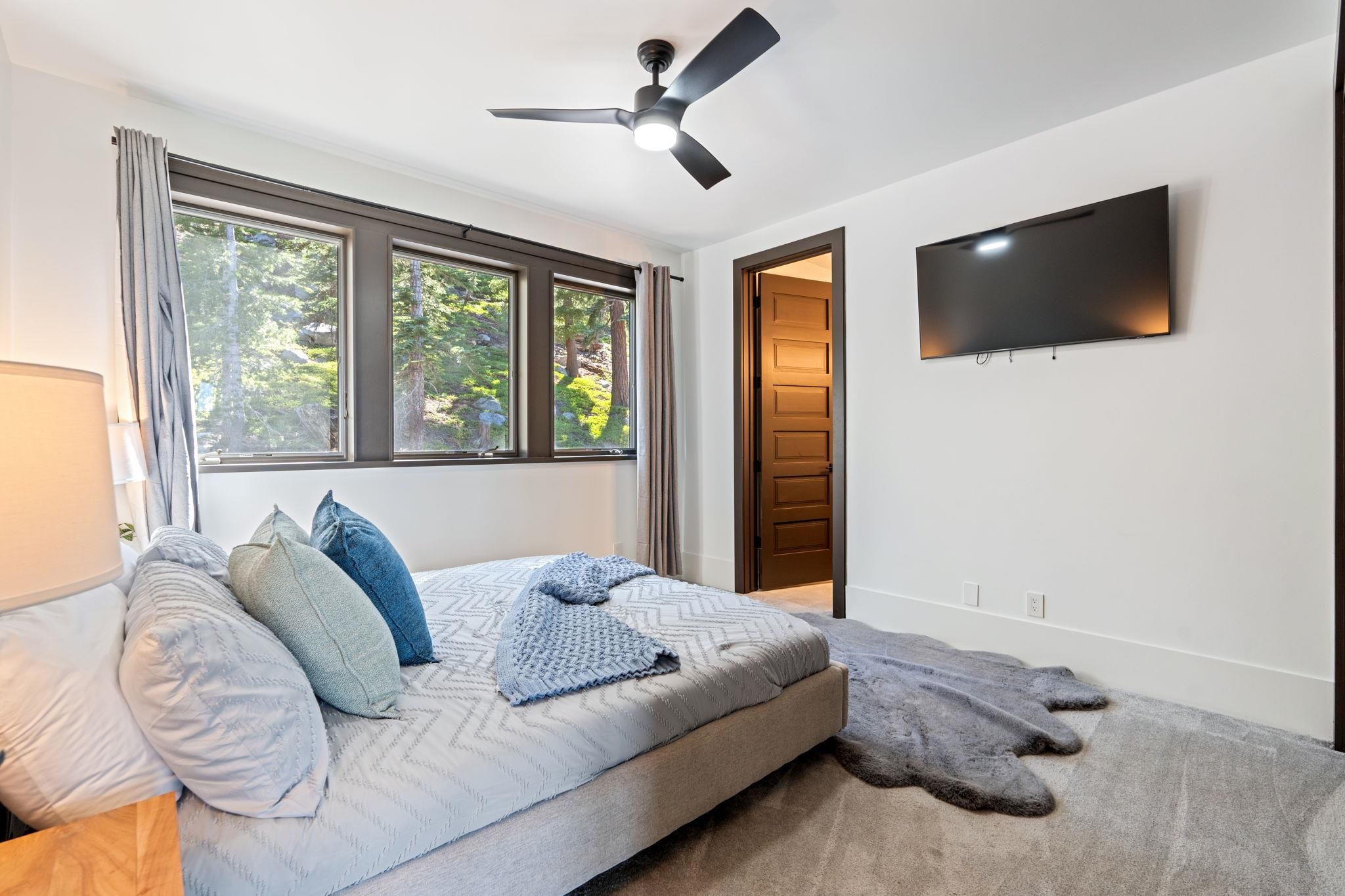1625 Black Bear Trail Stateline, NV 89449 - Photo 14 of 20 a living room with furniture a flat screen tv and a window