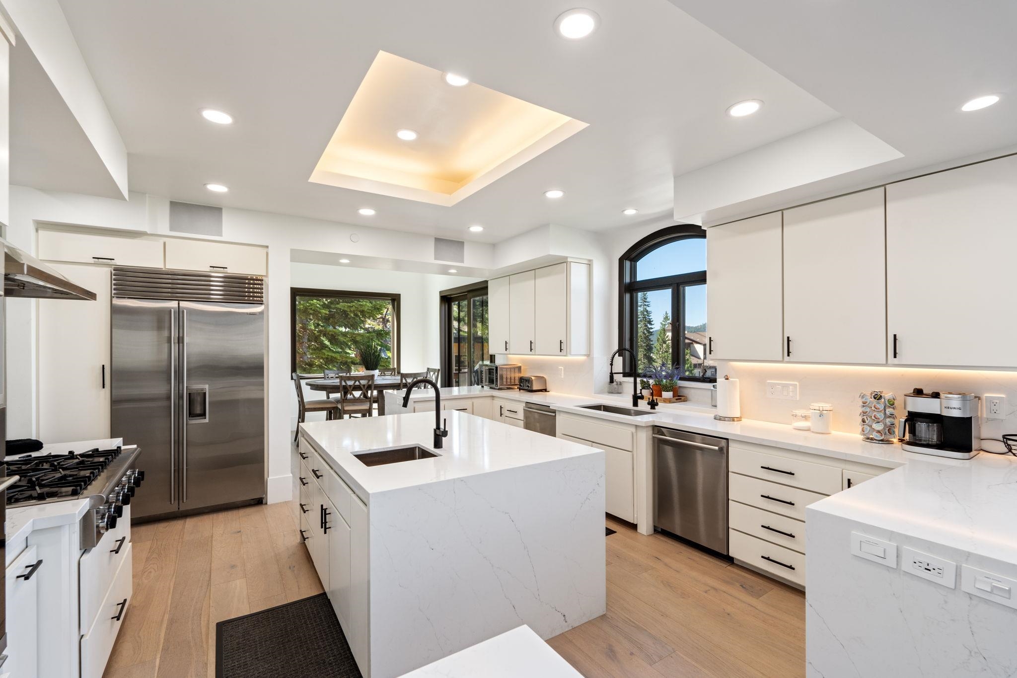 1625 Black Bear Trail Stateline, NV 89449 - Photo 7 of 20 a kitchen with a sink stainless steel appliances and cabinets