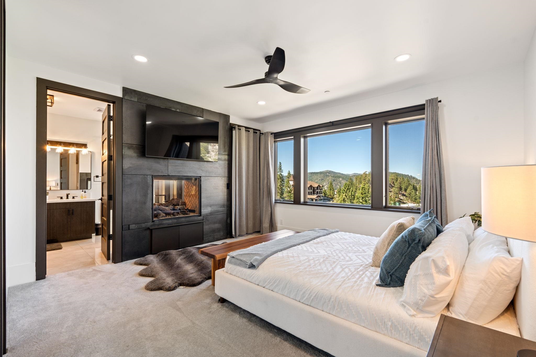 1625 Black Bear Trail Stateline, NV 89449 - Photo 10 of 20 a bedroom with a large bed and a large window