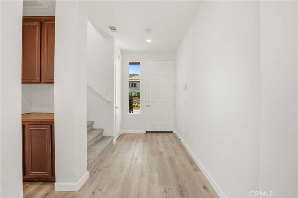 31598 Six Rivers Court Temecula, CA 92592 - Photo 12 of 43 a view of hallway with wooden floor