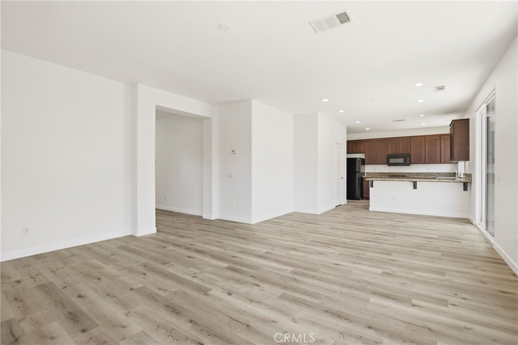 31598 Six Rivers Court Temecula, CA 92592 - Photo 15 of 43 a view of a kitchen with a sink and a refrigerator
