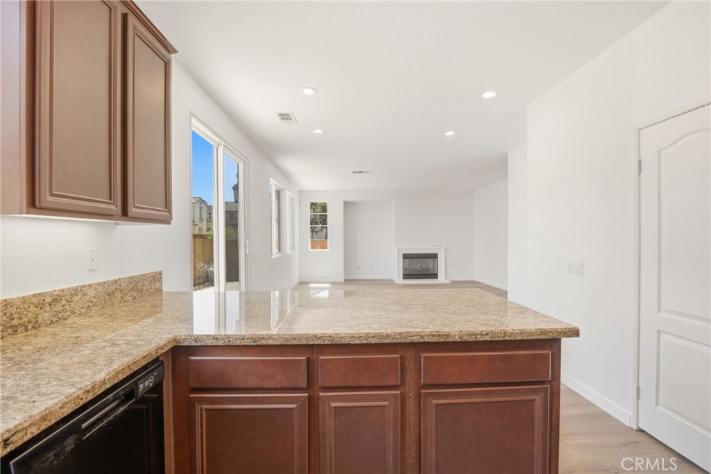 31598 Six Rivers Court Temecula, CA 92592 - Photo 20 of 43 a kitchen with a sink and cabinets